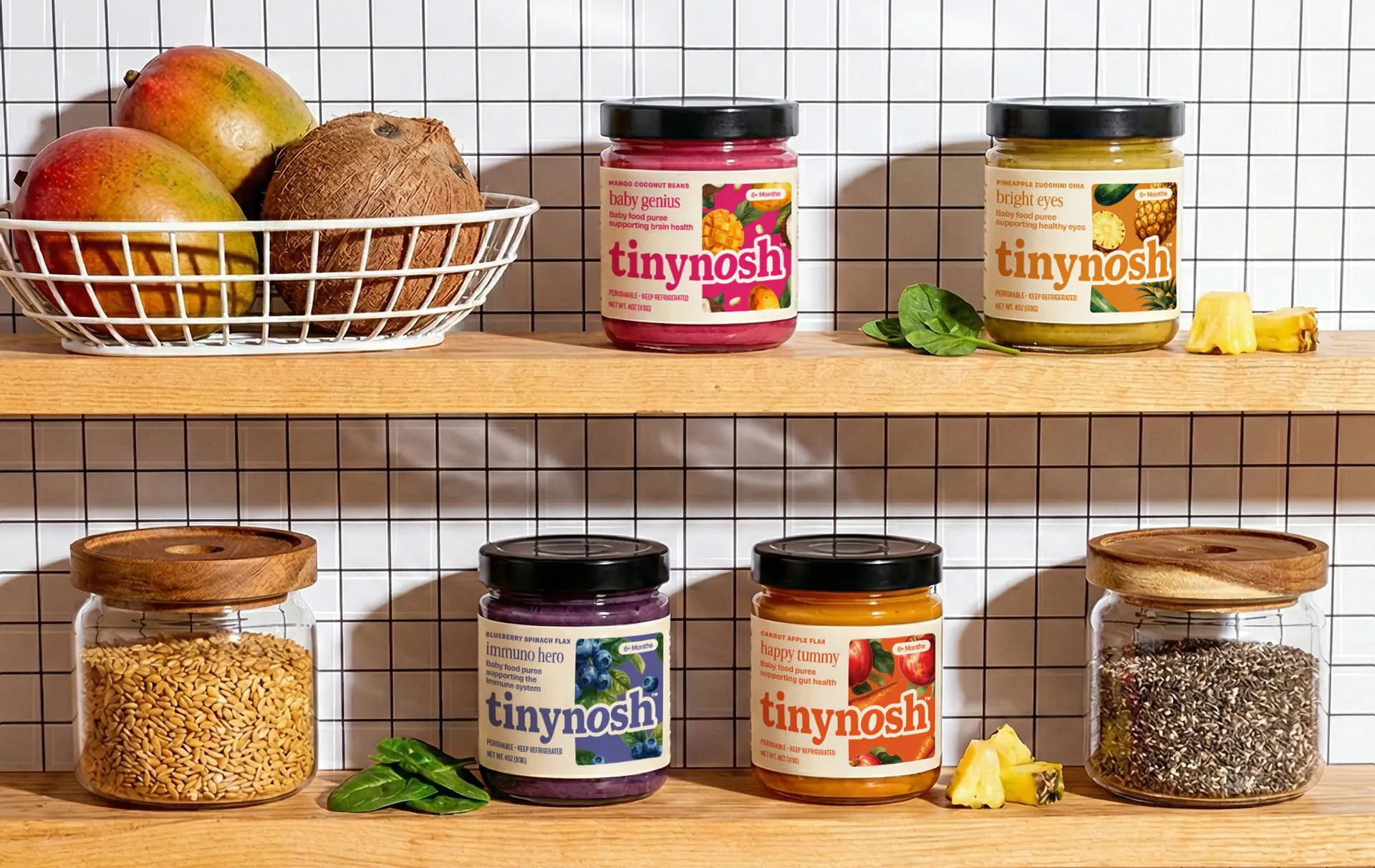 A row of Tinynosh jars on a pantry shelf